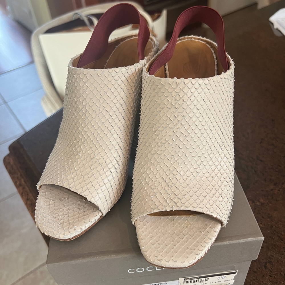 Great open toe snakeskin sling with elastic back to stay on! Wood heel!